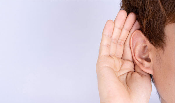 attempting to hear something