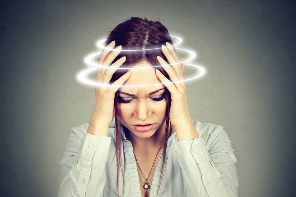 woman struggling with dizziness